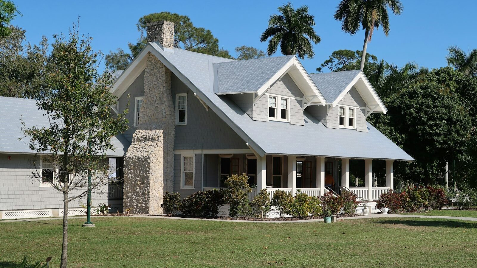 A welcoming Florida home with a porch and palm trees