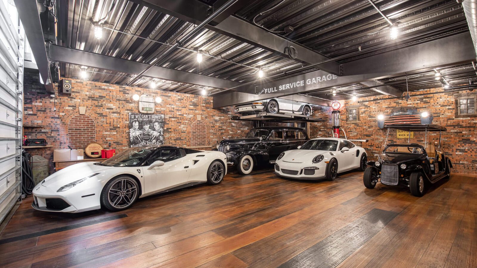 Luxury sports cars inside a private garage at The Motor Enclave