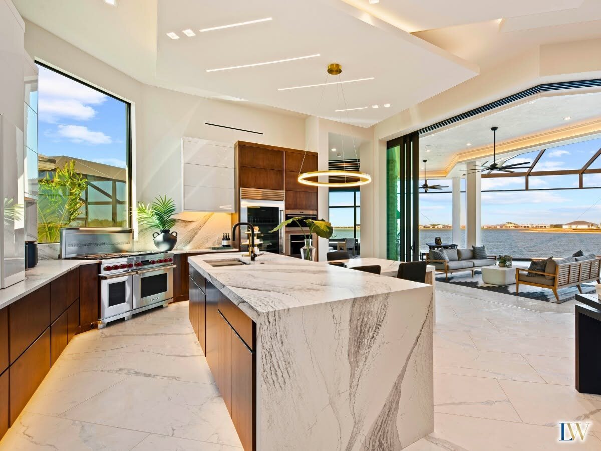 An open great room and kitchen with a water view in a Lee Wetherington home