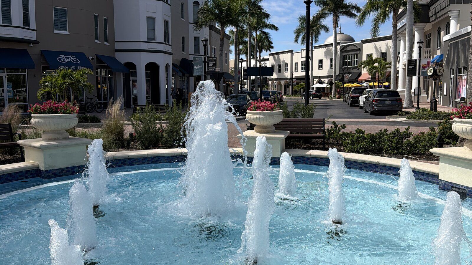 Main Street in Lakewood Ranch with its fountain, shops, and palm trees