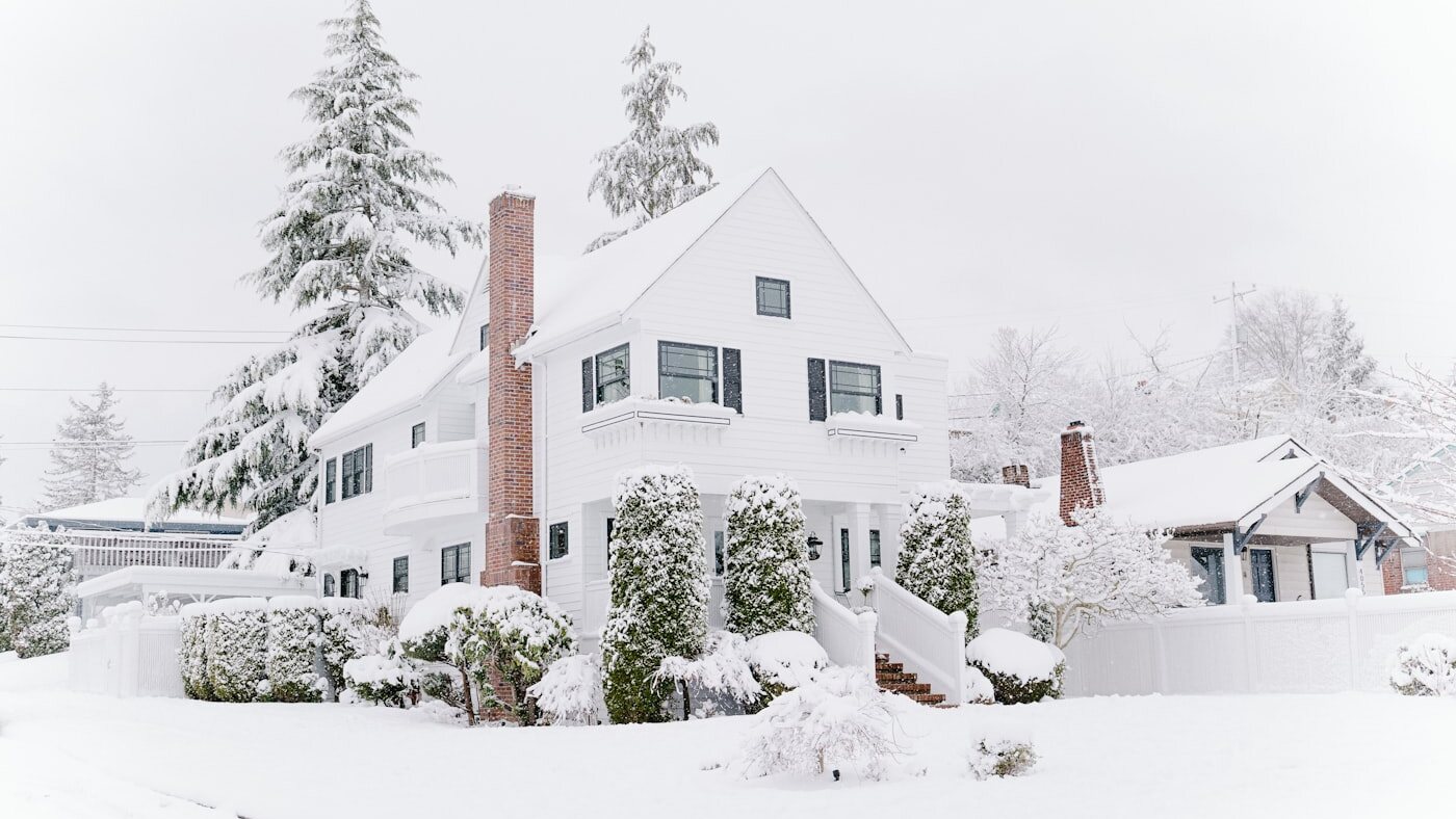 A home buried in deep snow during an Upstate New York winter